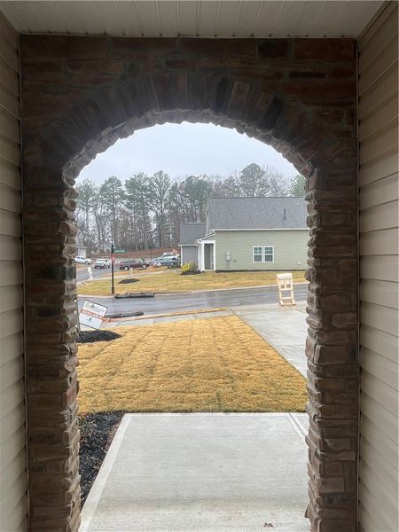 Exterior details and patio area of a home in Springwood Grove, Central (Image 4).