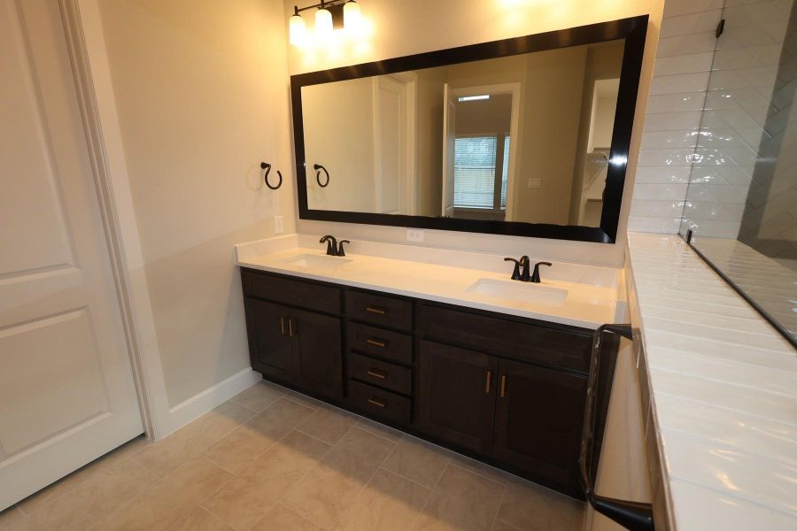 Furnished interior view inside a new home in Harvest Green - Reserve Collection, Richmond (Image 3).