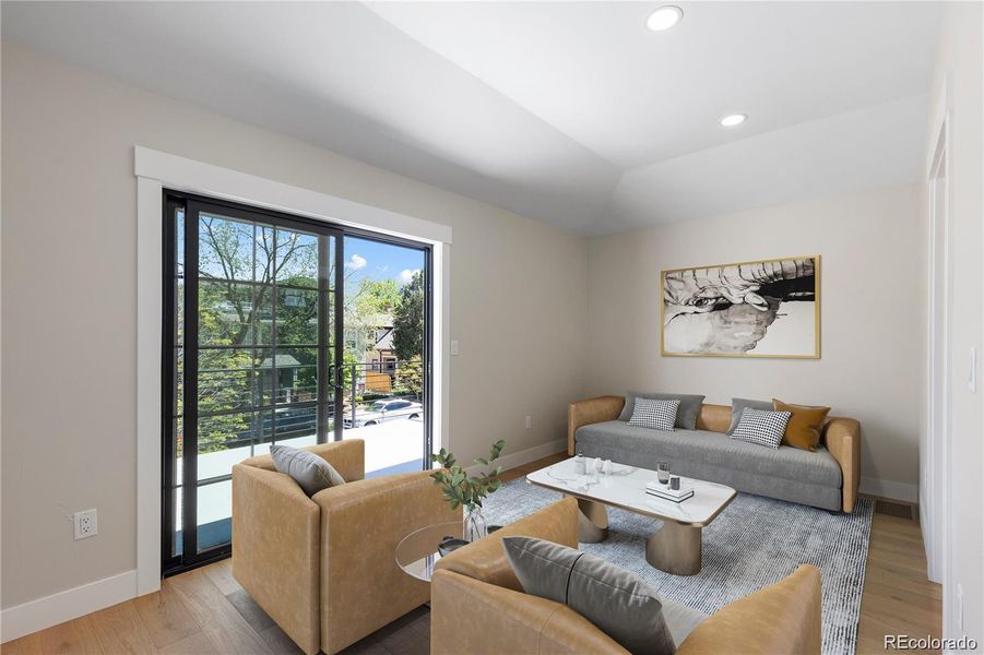 Loft that opens to a large rooftop deck throughmodern sliding doors (virtually staged to showdesign options) Loft that opens to a large rooftop deck throughmodern sliding doors (virtually staged to showdesign options)