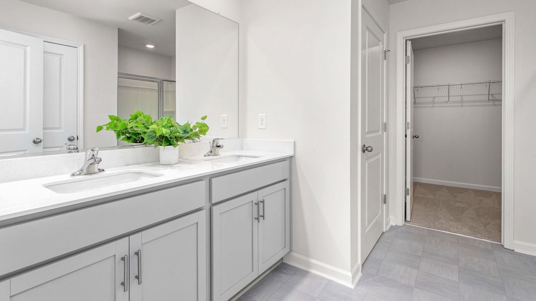 Representative furnished interior of a home built from the PENWELL by D.R. Horton in The Reserve at Stoney Creek, Whitsett (Image 26).