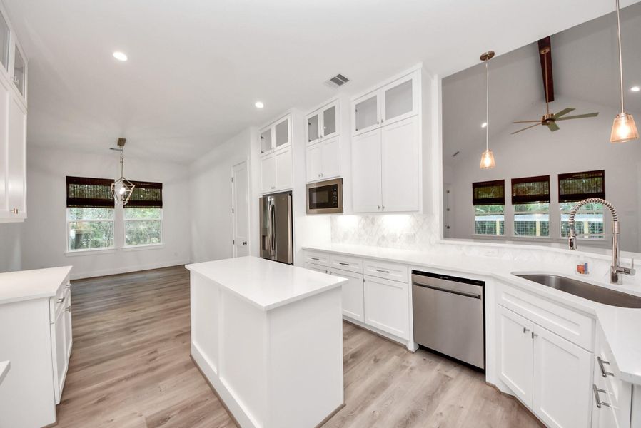Expansive kitchen with plenty of storage and prep space.