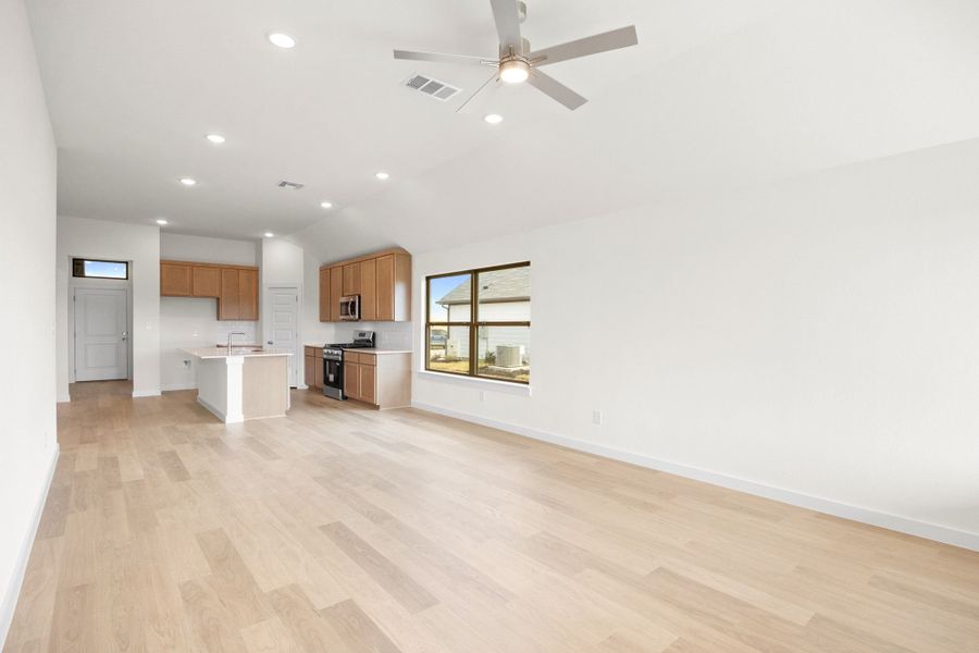 Dining and Living Areas in the Turquoise home plan by Trophy Signature Homes – REPRESENTATIVE PHOTO