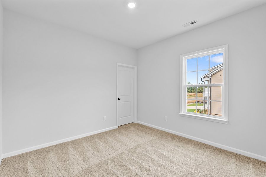 Spacious, unfurnished interior of a new home in Lilah Grove, Summerfield (Image 45).