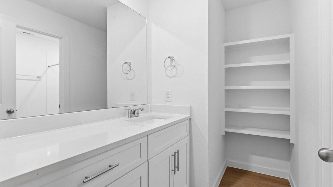 A well-designed bathroom equipped with granite countertops, emphasizing functionality and contemporary style. A well-designed bathroom equipped with granite countertops, emphasizing functionality and contemporary style.