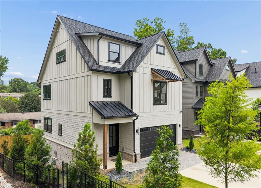 Front exterior of a new home in , Smyrna, GA, highlighting curb appeal (Image 1). Front exterior of a new home in , Smyrna, GA, highlighting curb appeal (Image 1).