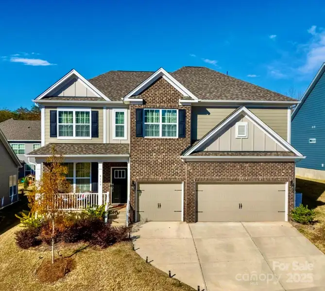 Front exterior of a new home in Sylvan Creek, Denver, NC, highlighting curb appeal (Image 1). Front exterior of a new home in Sylvan Creek, Denver, NC, highlighting curb appeal (Image 1).