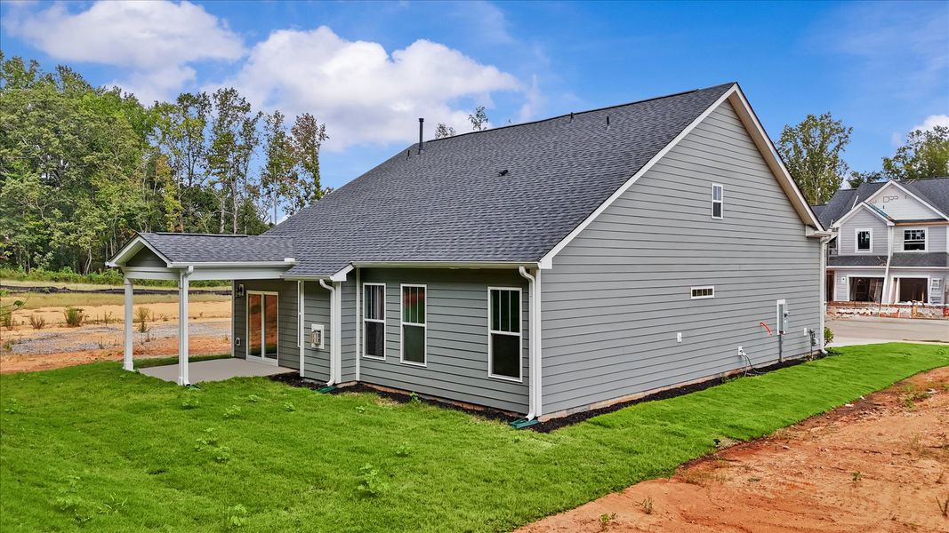 Accomplished exterior with a spacious rear porch that blends comfort and style