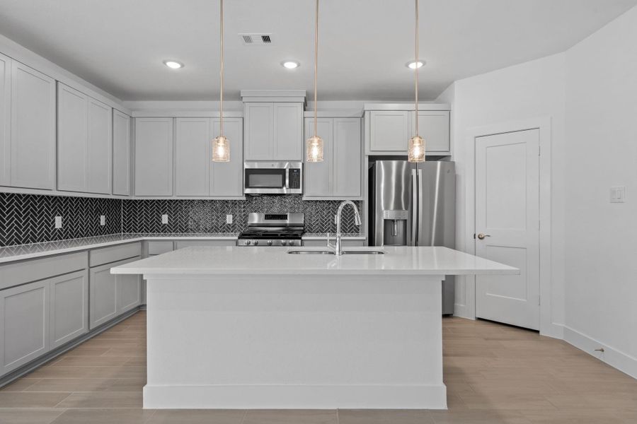 Furnished interior view inside a new home in Meridiana, Iowa Colony (Image 11).