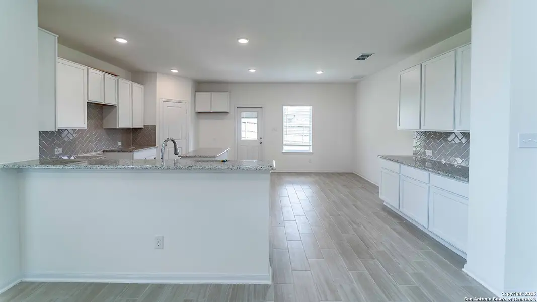 Furnished interior view inside a new home in Hunter's Ranch, San Antonio (Image 1).