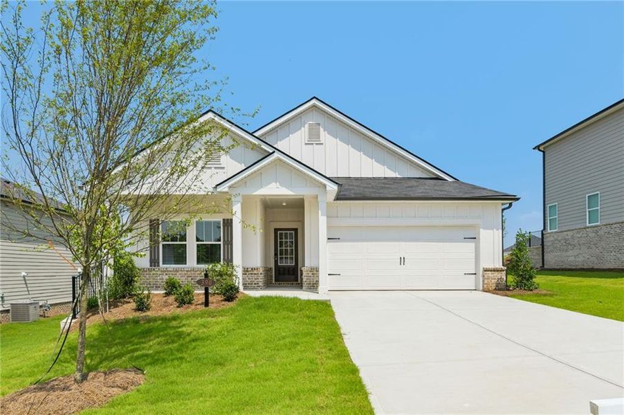 Front exterior of a new home in Preserve at Mountain Creek, Pendergrass, GA, highlighting curb appeal (Image 2). Front exterior of a new home in Preserve at Mountain Creek, Pendergrass, GA, highlighting curb appeal (Image 2).
