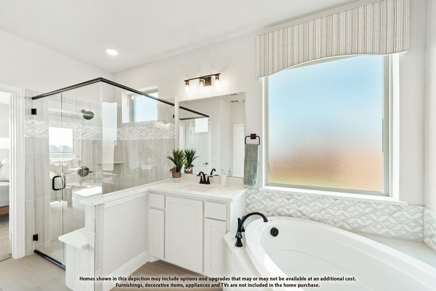 Master bathroom with glass walk-in shower, soaking tub, white vanity, and large frosted window Master bathroom with glass walk-in shower, soaking tub, white vanity, and large frosted window