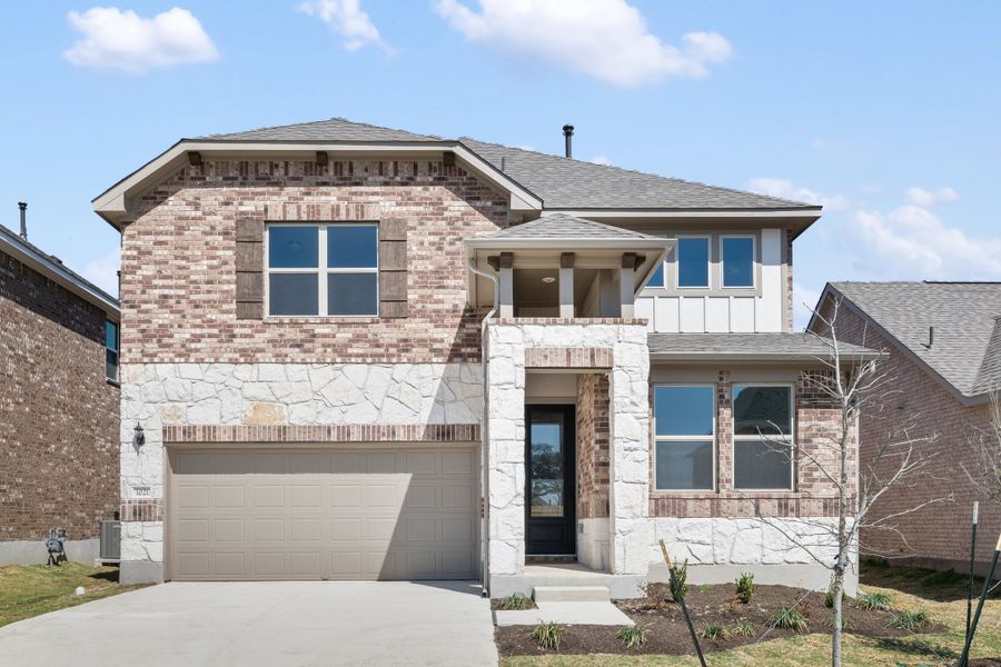 Representative exterior photo of a completed home built from the Colton by Ashton Woods in Berry Creek Highlands, Georgetown, TX (Image 14).