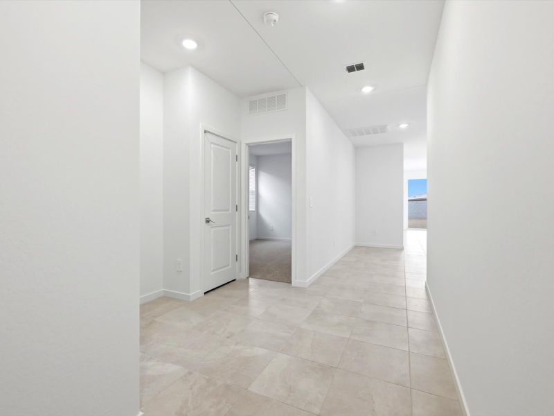Spacious, unfurnished interior of a new home in Rancho Mirage Estate Series, Maricopa (Image 12).