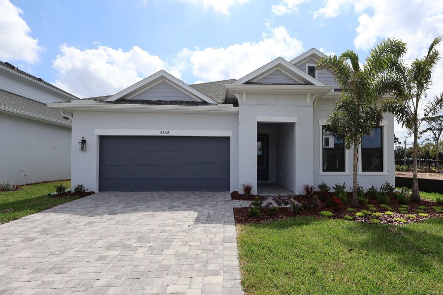 Representative exterior photo of a completed home built from the The Stratum by David Weekley Homes in Lakeview Crossing – Tradition Series, Sarasota, FL (Image 1). Representative exterior photo of a completed home built from the The Stratum by David Weekley Homes in Lakeview Crossing – Tradition Series, Sarasota, FL (Image 1).
