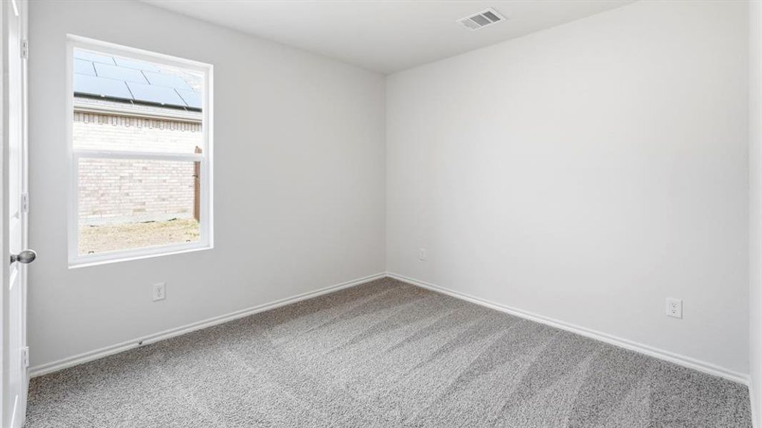 Unfurnished room featuring light carpet and baseboards Unfurnished room featuring light carpet and baseboards