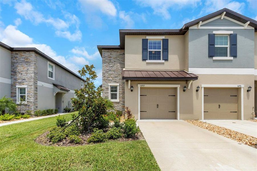 Front exterior of a new home in , Land O' Lakes, FL, highlighting curb appeal (Image 22).