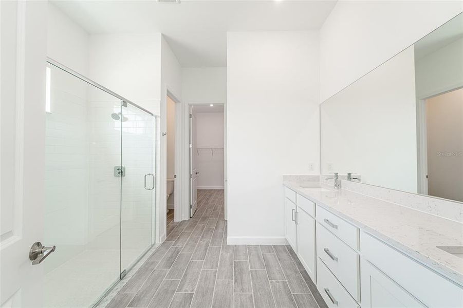 Furnished interior view inside a new home in Tesoro Club, Port St. Lucie (Image 11).