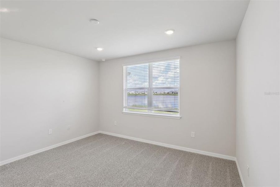 Spacious, unfurnished interior of a new home in Crescent Lakes - Premier Series, Punta Gorda (Image 24).