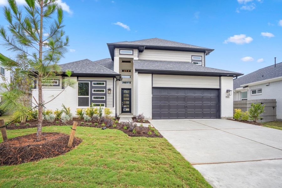 Front exterior of a new home in ARTAVIA 55' Lots, Conroe, TX, highlighting curb appeal (Image 28).