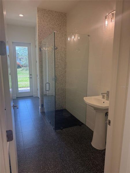 Pool Bath: shower, pedestal sink, private toilet & linen closet