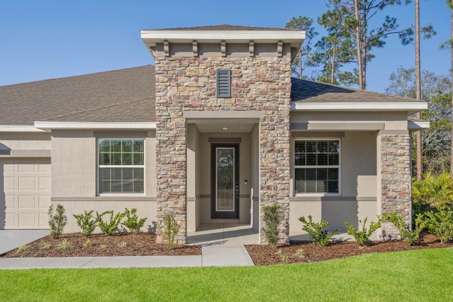 Front exterior of a new home in Sugarmill Woods, Homosassa, FL, highlighting curb appeal (Image 21).