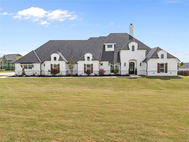 Front exterior of a new home in Woodland Meadows, Fort Worth, TX, highlighting curb appeal (Image 20).
