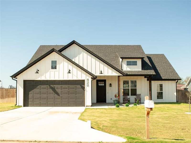 Front exterior of a new home in , Tolar, TX, highlighting curb appeal (Image 1). Front exterior of a new home in , Tolar, TX, highlighting curb appeal (Image 1).