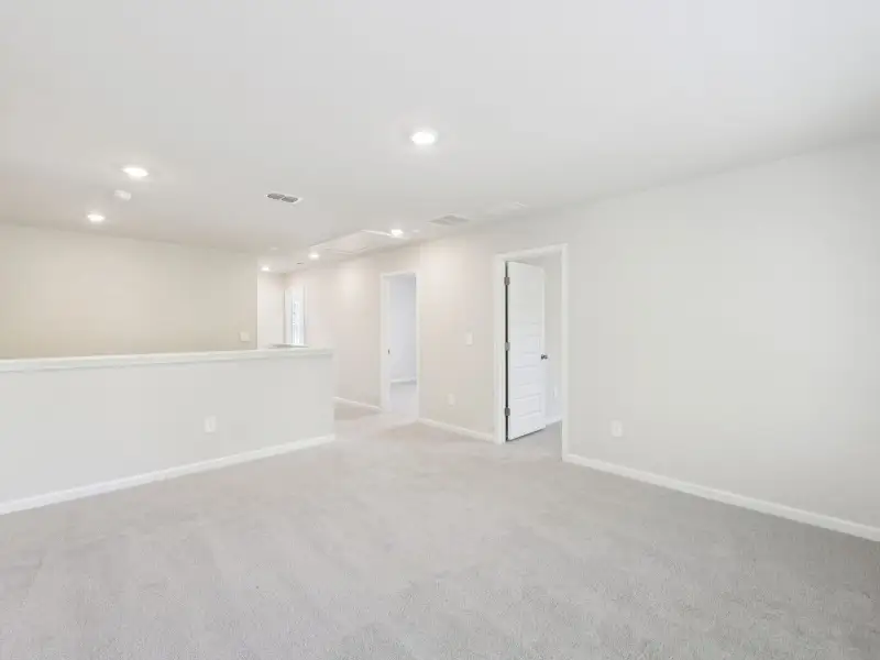 Spacious, unfurnished interior of a new home in Vines at Mill Creek - Estate Series, Braselton (Image 16).