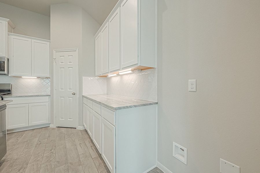 Representative furnished interior of a home built from the Floor Plan 2050 by Colina Homes in Grand Magnolia, Magnolia (Image 18).