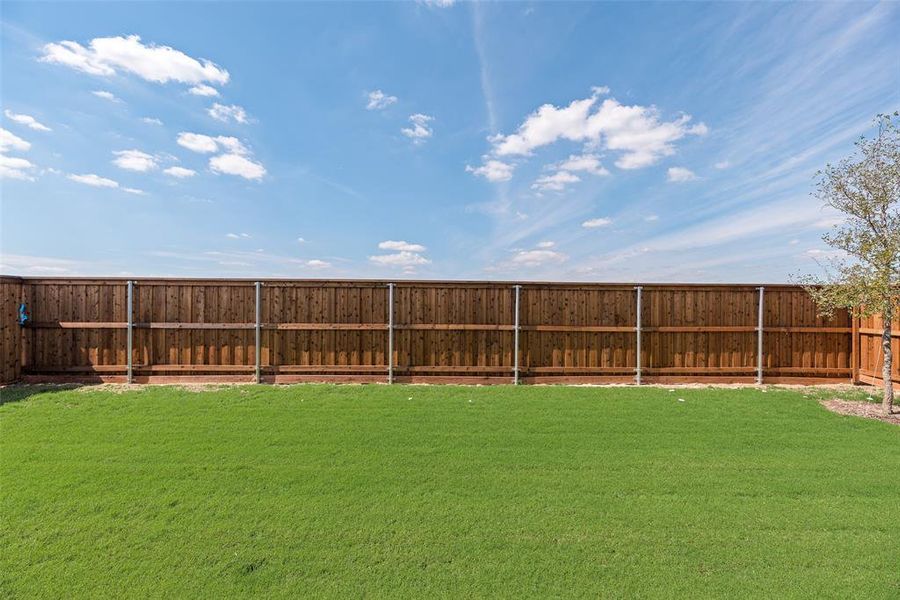 Exterior details and patio area of a home in Spiritas Ranch, Little Elm (Image 19). Exterior details and patio area of a home in Spiritas Ranch, Little Elm (Image 19).