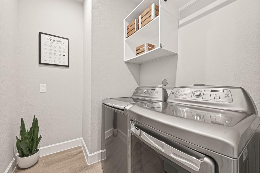 Laundry room equipped with both electric and gas dryer connections. (Note: Photo is staged; property is currently vacant.) Laundry room equipped with both electric and gas dryer connections. (Note: Photo is staged; property is currently vacant.)