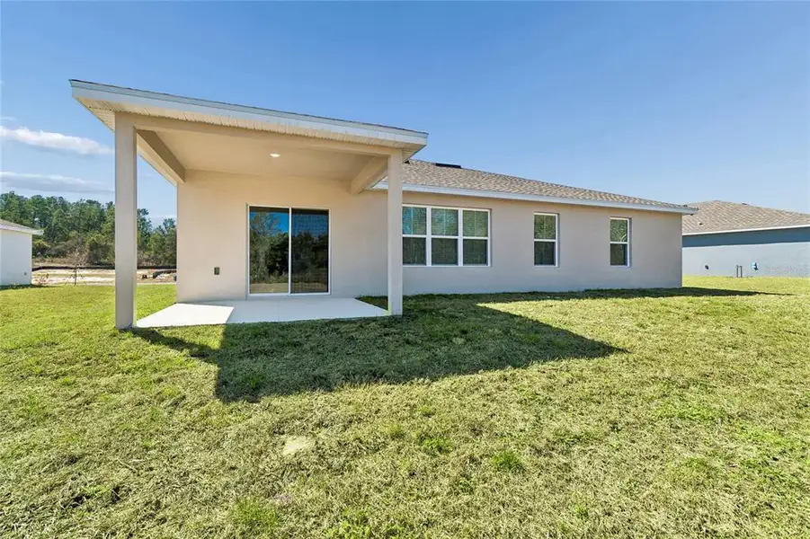 Exterior details and patio area of a home in Aspire at Glen Aire, Ocala (Image 19).