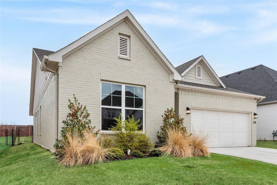 Front exterior of a new home in , Aledo, TX, highlighting curb appeal (Image 24).