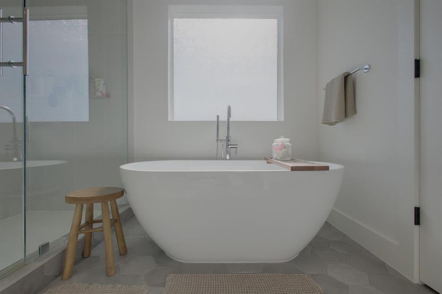 Bathroom featuring tile patterned floors and a bathtub