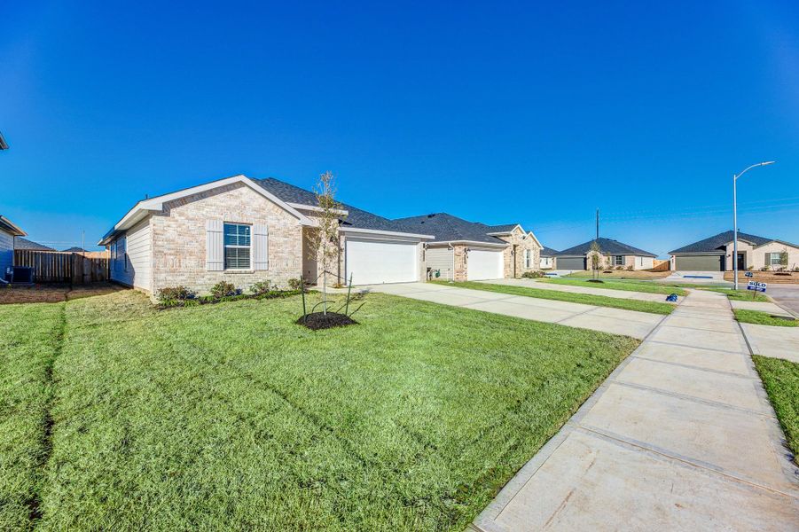 Front exterior of a new home in , Fulshear, TX, highlighting curb appeal (Image 15). Front exterior of a new home in , Fulshear, TX, highlighting curb appeal (Image 15).