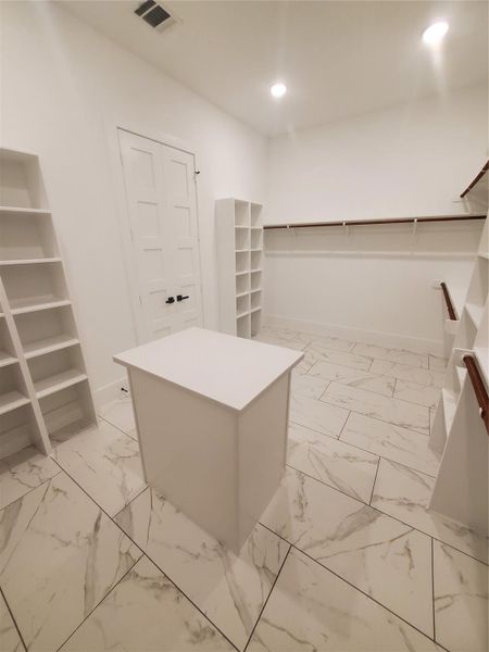 PRIMARY CLOSET FACING BATHROOM DOORS PRIMARY CLOSET FACING BATHROOM DOORS