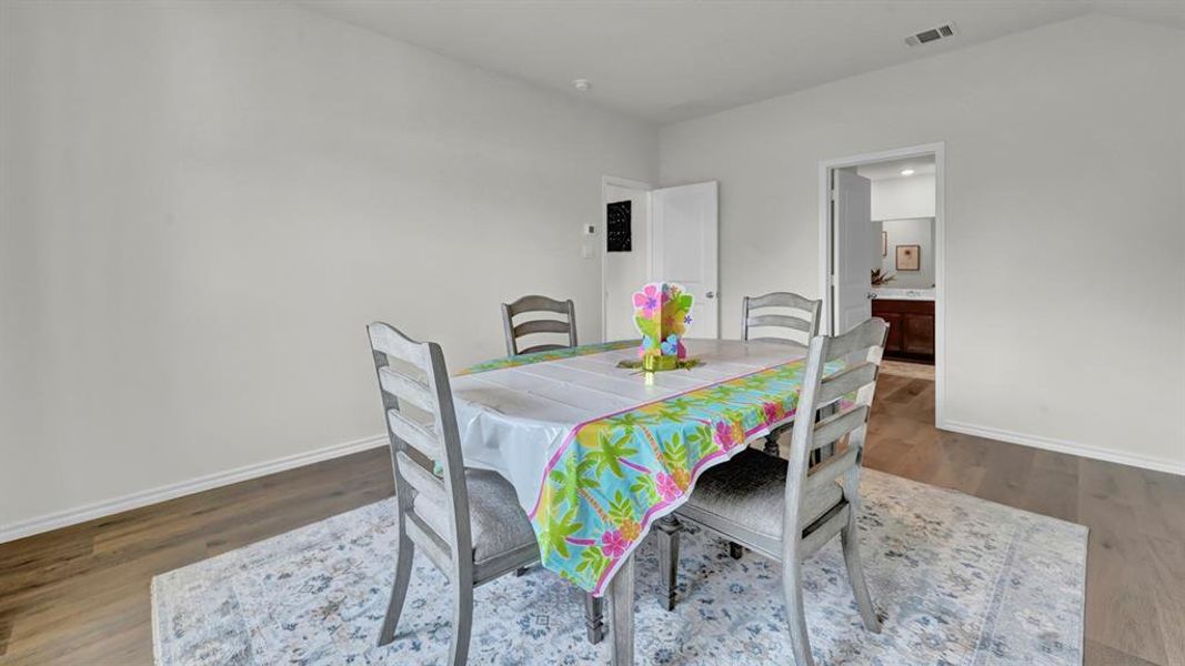 Dining area with wood finished floors