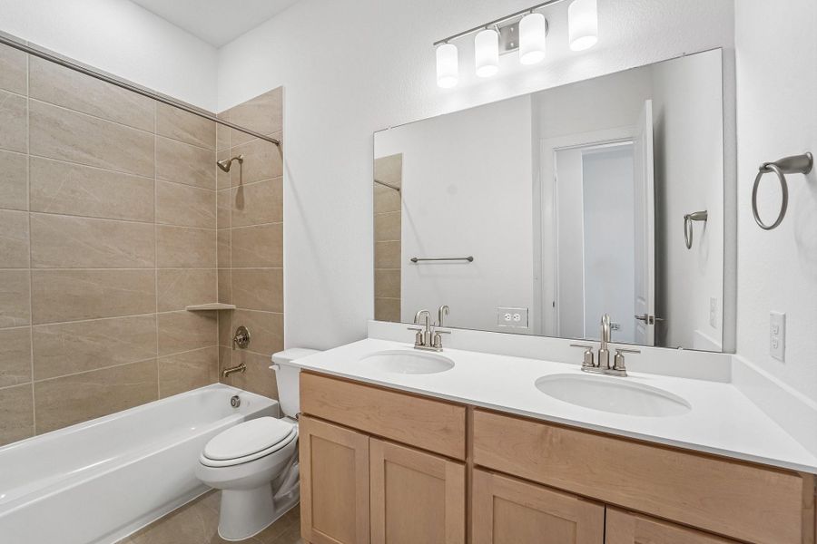 Furnished interior view inside a new home in Del Bello Lakes 60', Manvel (Image 9).