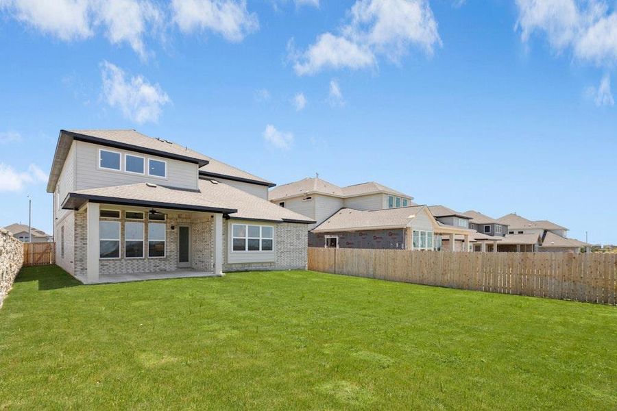 Front exterior of a new home in University Heights, Round Rock, TX, highlighting curb appeal (Image 18).