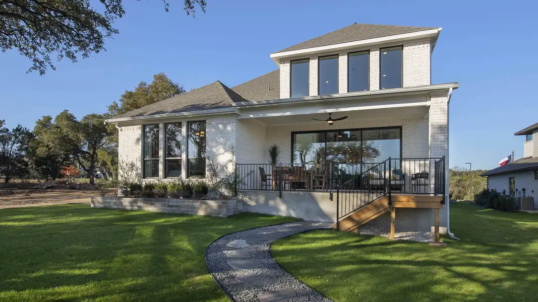 Representative exterior photo of a completed home built from the 2694W by Perry Homes in Flora 50', Hutto, TX (Image 12).
