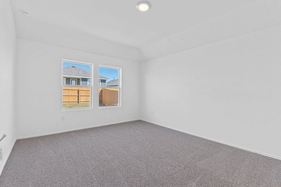 Carpeted empty room with baseboards