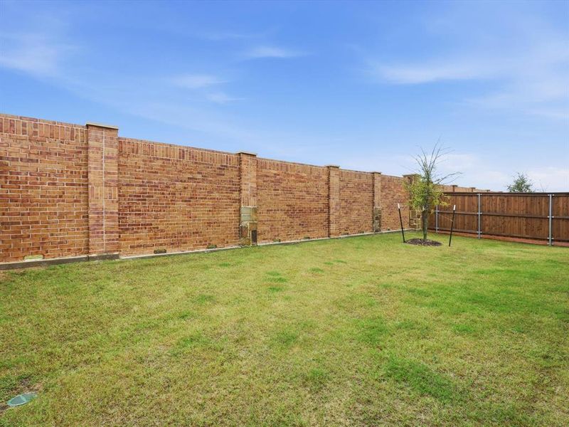 Exterior details and patio area of a home in , Little Elm (Image 2). Exterior details and patio area of a home in , Little Elm (Image 2).