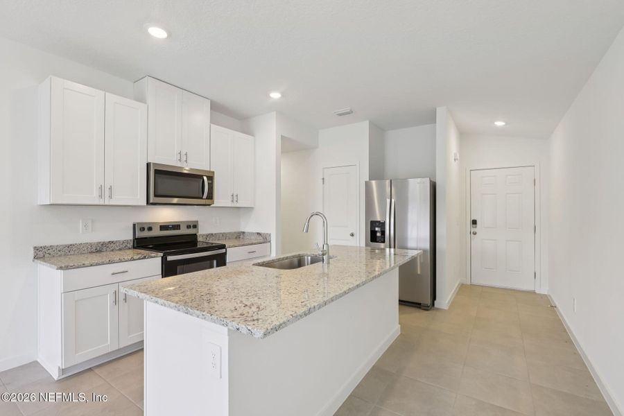 Furnished interior view inside a new home in Flagler Village - Classic Series, Palm Coast (Image 6).