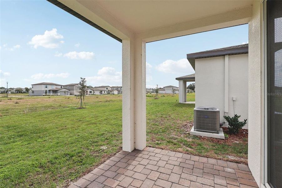 Exterior details and patio area of a home in The Reserve at Twin Lakes, St. Cloud (Image 19).