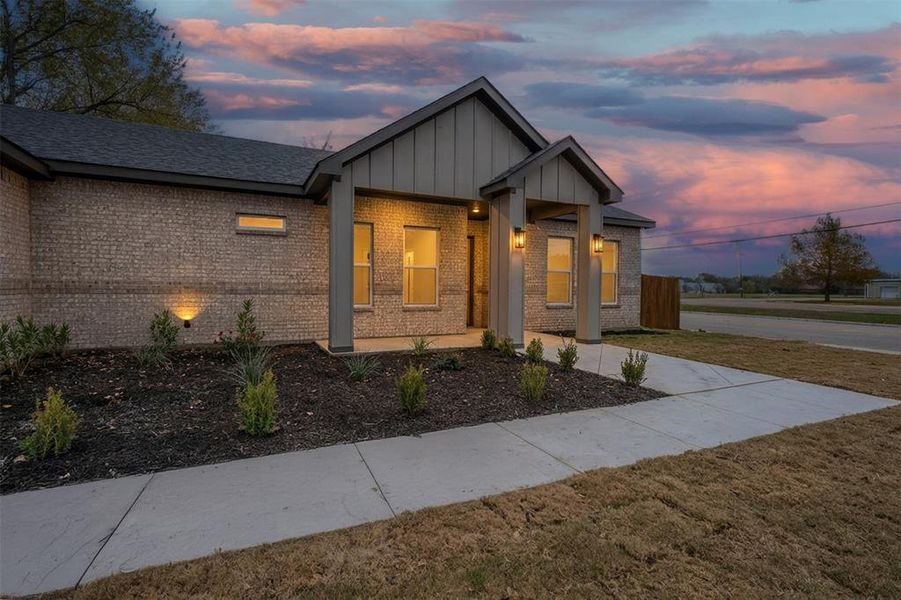 Front exterior of a new home in , Grand Prairie, TX, highlighting curb appeal (Image 2). Front exterior of a new home in , Grand Prairie, TX, highlighting curb appeal (Image 2).