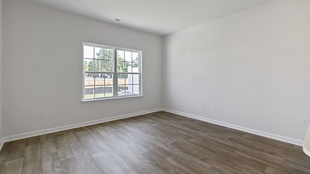 Spacious, unfurnished interior of a new home in The Townes at Bexford, Willow Spring (Image 7).