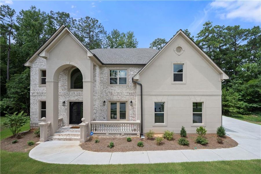 Front exterior of a new home in , Fairburn, GA, highlighting curb appeal (Image 1). Front exterior of a new home in , Fairburn, GA, highlighting curb appeal (Image 1).