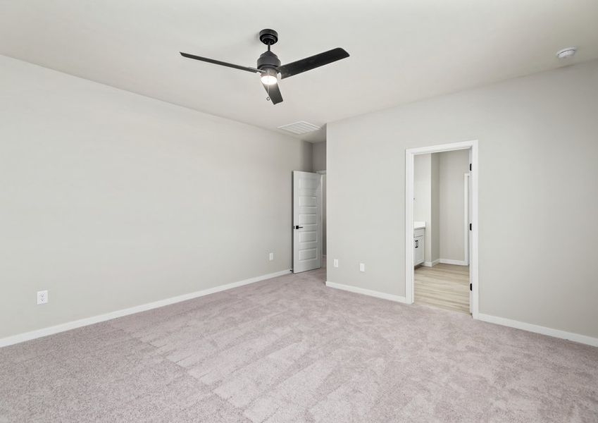 The master bedroom seamlessly connects to the master bath.