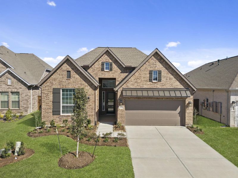 Front exterior of a new home in The Trails, New Caney, TX, highlighting curb appeal (Image 22). Front exterior of a new home in The Trails, New Caney, TX, highlighting curb appeal (Image 22).