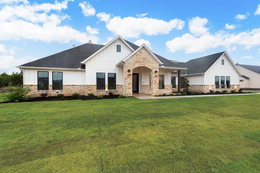 View of front of home featuring a front lawn